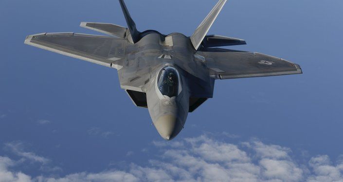 A F-22 Raptor fighter jet of the 95th Fighter Squadron from Tyndall, Florida approaches a KC-135 Stratotanker from the 100th Air Refueling Wing at the Royal Air Force Base in Mildenhall in Britain as they fly over the Baltic Sea towards the newly established NATO airbase of Aemari, Estonia September 4, 2015.