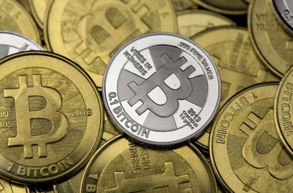 Some of Bitcoin enthusiast Mike Caldwell's coins are pictured at his office in this photo illustration in Sandy, Utah, January 31, 2014. REUTERS/Jim Urquhart
