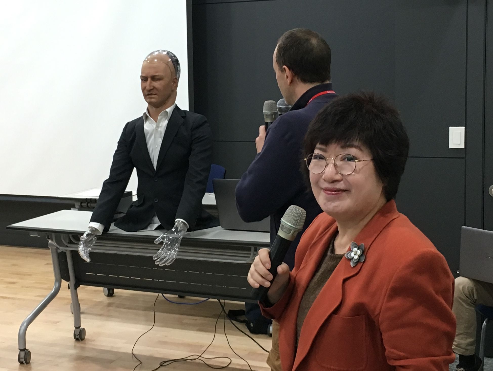 Prof. Youngsook Park stands in front of the Han robot.