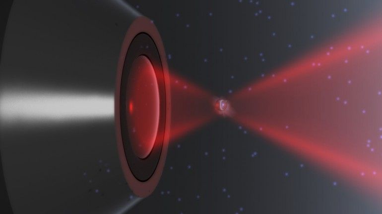 A rendering of a nanoparticle trapped in a laser and in thermal non-equilibrium (Image: Iñ...