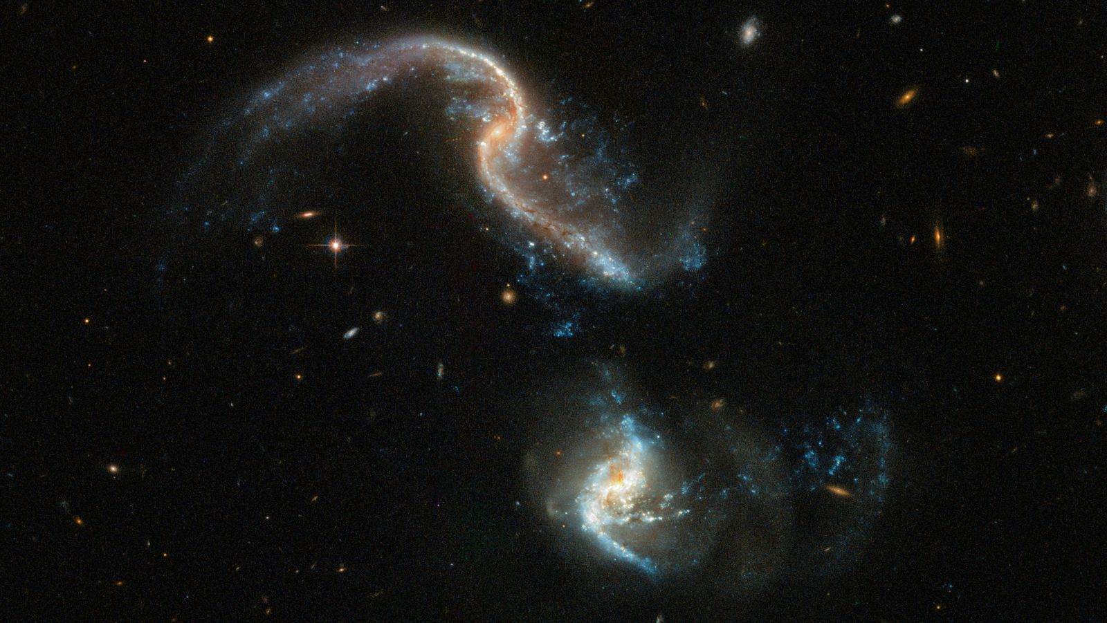 The Hubble Space Telescope captured two galaxies colliding